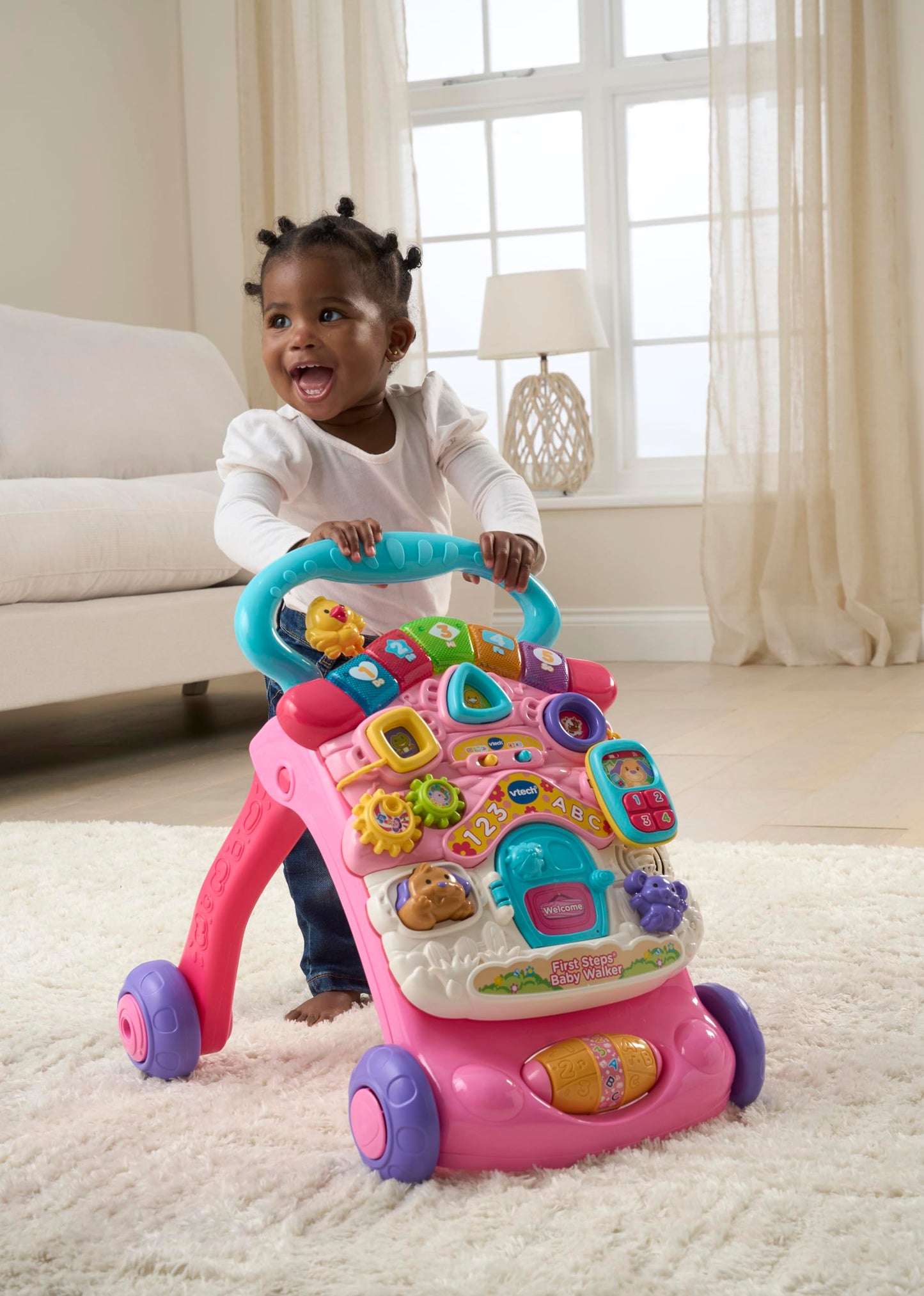 VTech First Steps Baby Walker in pink with shapes, sounds, music, and pretend play features for infants and toddlers.