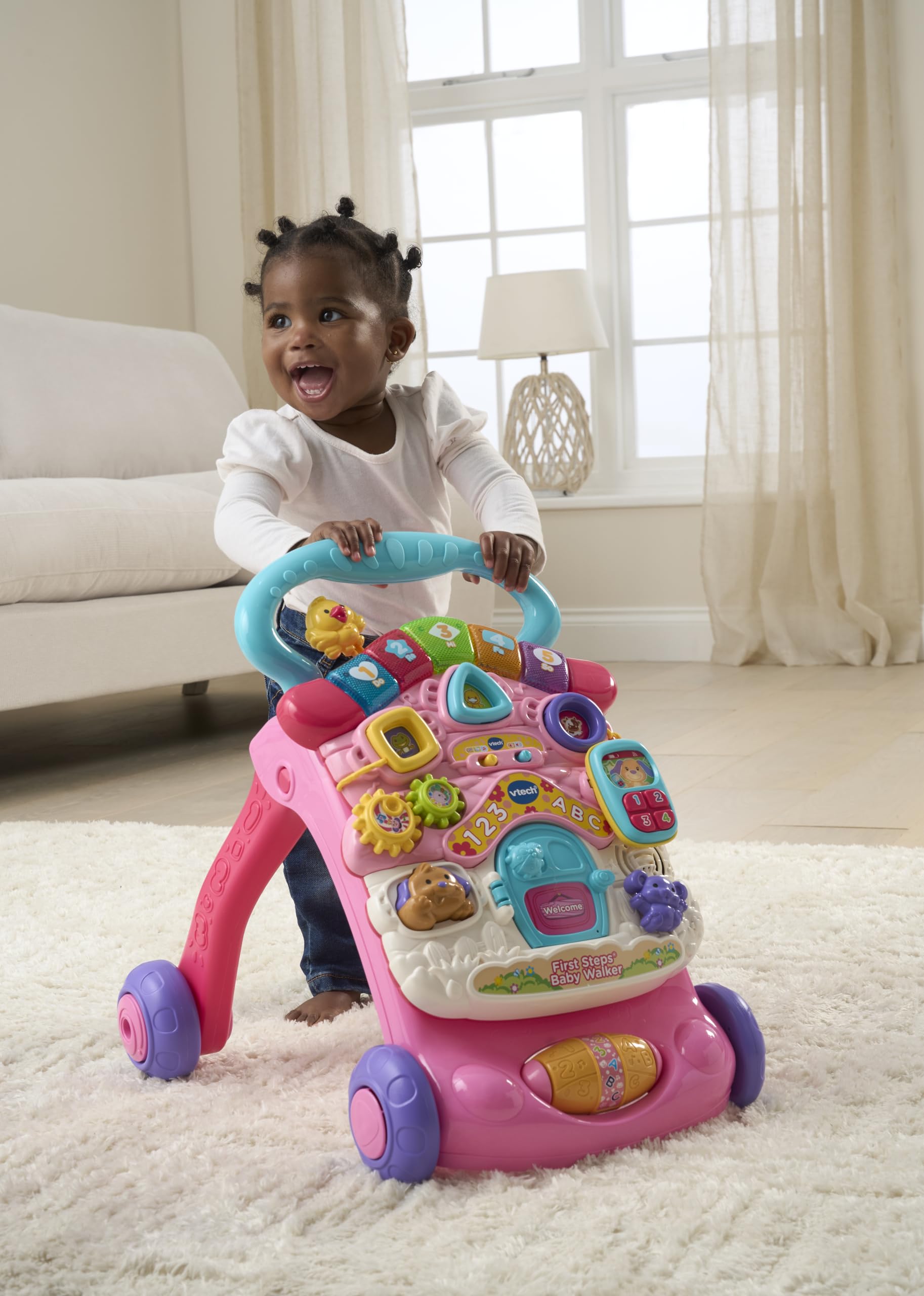 VTech First Steps Baby Walker in pink with shapes, sounds, music, and pretend play features for infants and toddlers.
