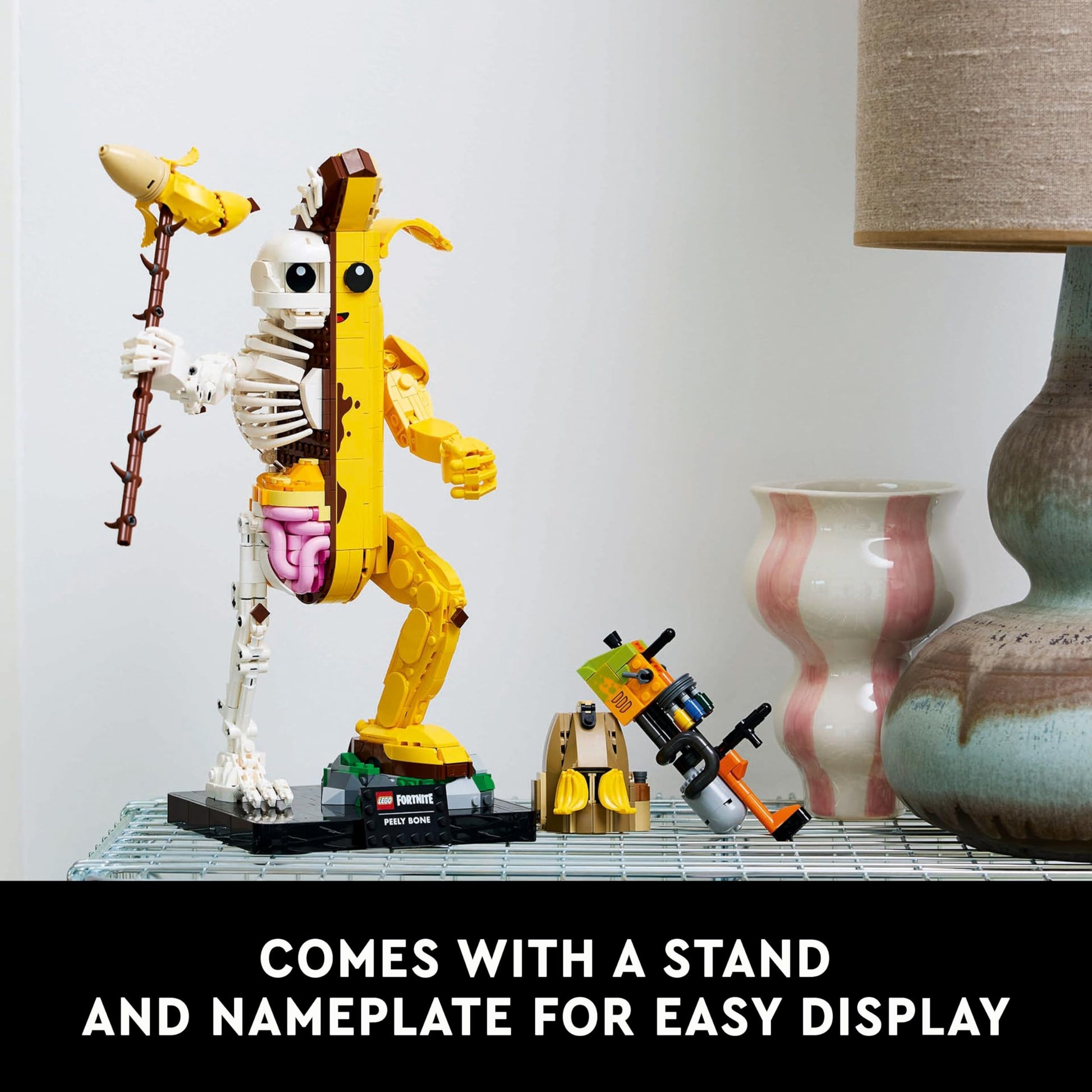 LEGO Fortnite Peely Bone collectible figure with paint launcher and Peely pickaxe, ideal for gaming fans and display.