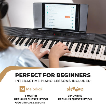 Alesis Melody 61 keyboard piano for beginners with 61 keys, speakers, stand, bench, headphones, and tablet/music stand.