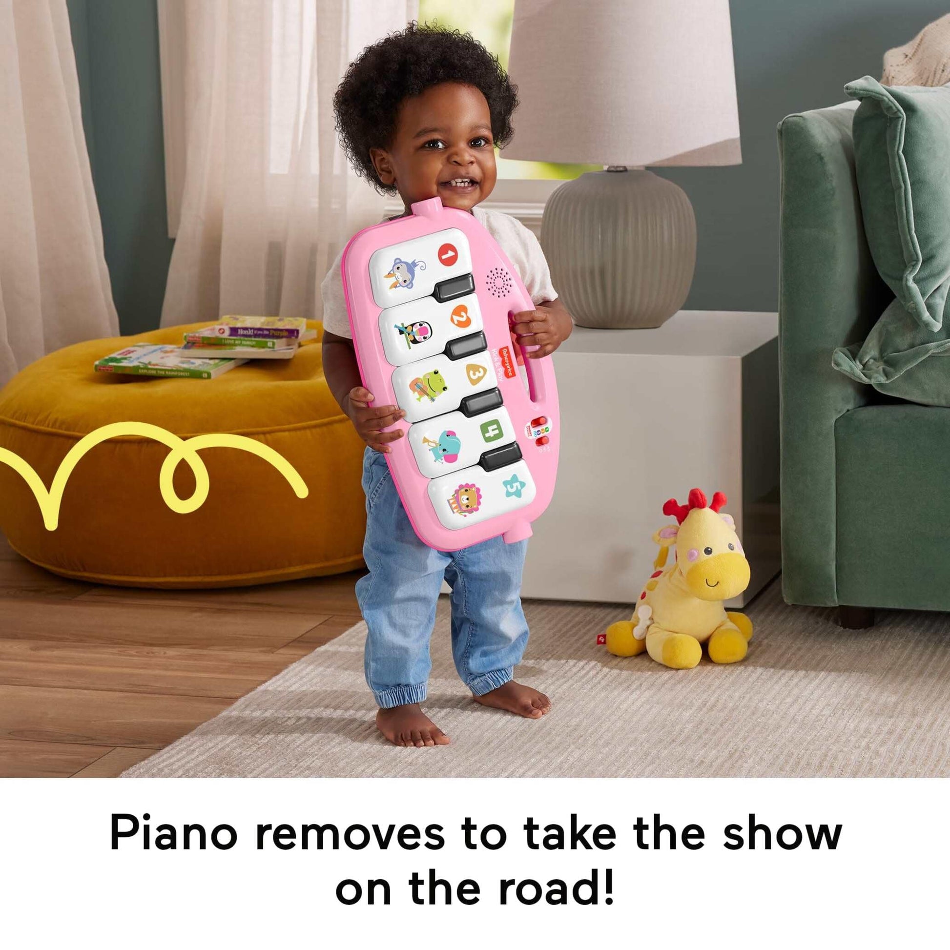 Fisher-Price Baby Activity Mat Glow and Grow Kick & Play Piano Gym with pink fabric, musical toys, and colorful hanging objects.