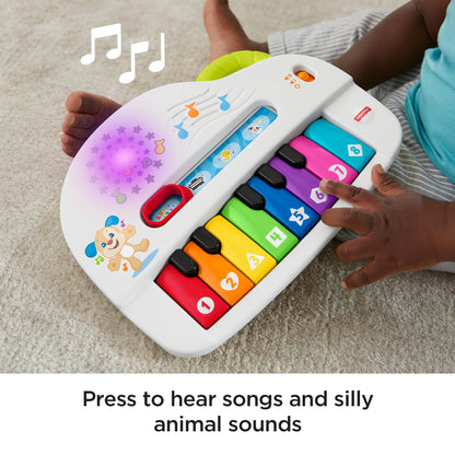 Fisher-Price Silly Sounds Light-Up Piano - UK English Edition, take-along toy piano with lights, real music notes and learning songs for baby and toddlers, GFK04