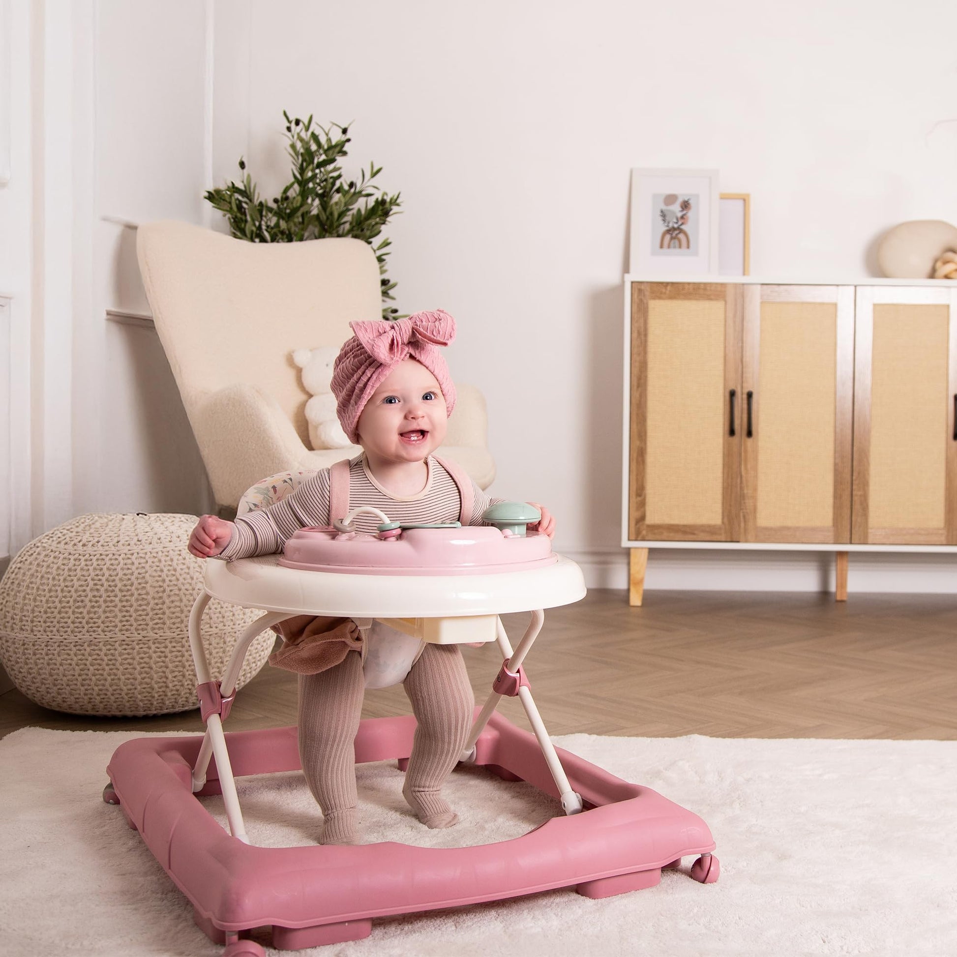 Red Kite Baby Go Round Jive electronic walker with interactive musical play tray in rose and ivy colors.