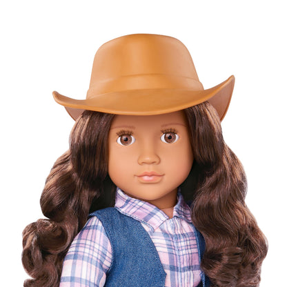 Our Generation Carolyn Cowgirl Doll in tall riding boots and cowboy hat, with lifelike brown eyes and a western outfit.