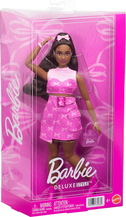 Barbie Deluxe Style Doll #10 in pink denim top and skirt with black hair, hearing aids, handbag, and bow print accessories.