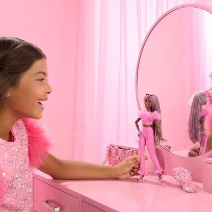 Barbie Deluxe Style Doll #4 in pink top and pant set, featuring brown braids and furry collar with fun accessories.