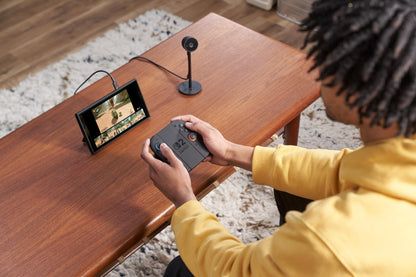 Nintendo Switch 2 Camera showing the device with dual lenses and screen, designed for gaming and video recording.