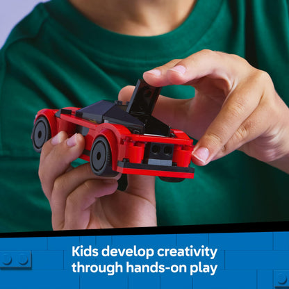 LEGO City red sports car toy with driver minifigure and accessories, designed for children aged 5 and up.