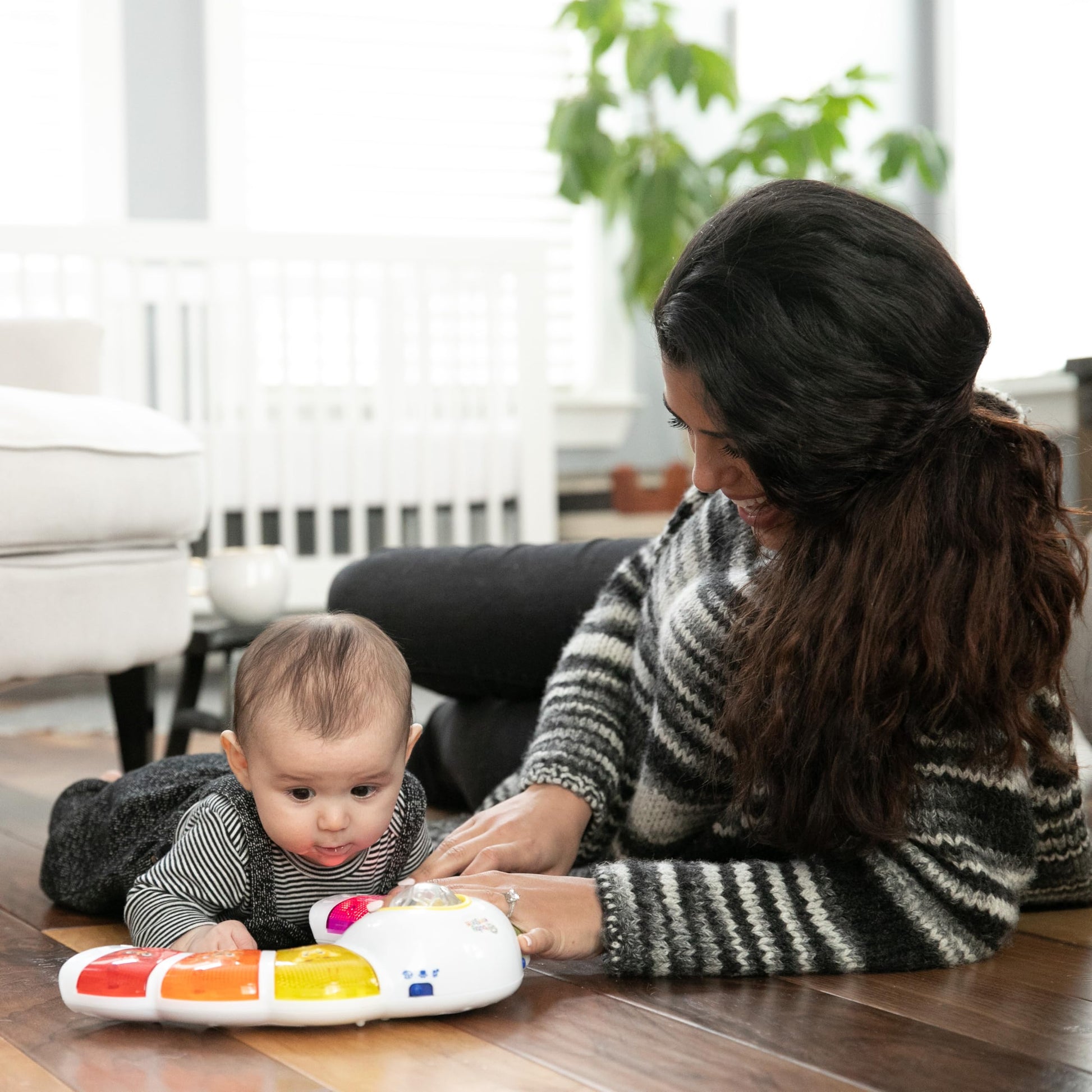 Baby Einstein Glow & Discover Light Bar musical activity station with colorful lights and buttons for tummy time and sensory play.