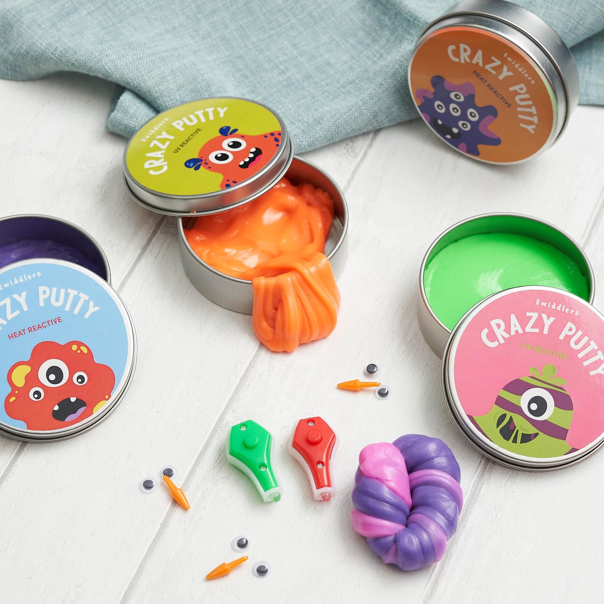 Color-changing putty in lid pots with mini UV torch, tactile sensory slime toy for kids by THE TWIDDLERS.