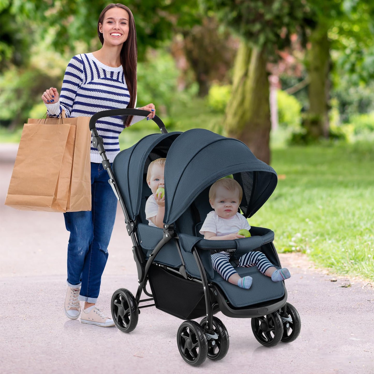 Costway double seat pushchair with navy fabric, foldable twin stroller, adjustable backrest, sunshade, safety belts, and storage basket.
