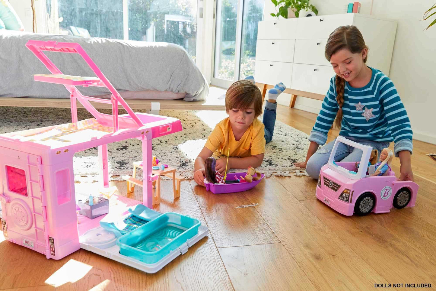 Barbie 3-in-1 Dream Camper doll playset with 50 accessories, transforming into truck, boat, and house with pool for imaginative play.