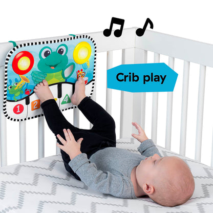 Baby Einstein Ocean Explorers Neptune's Kick & Explore musical kick pad and crib toy for infants, with colorful ocean-themed design.