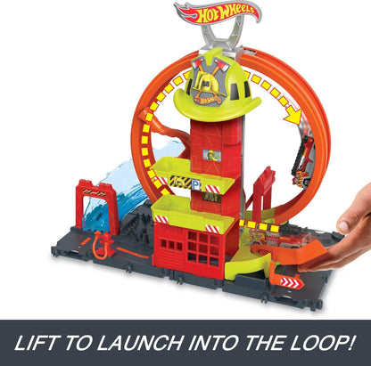 Hot Wheels City playset featuring a toy car, kid-powered elevator, water-like ramp, and fire station with super loop.