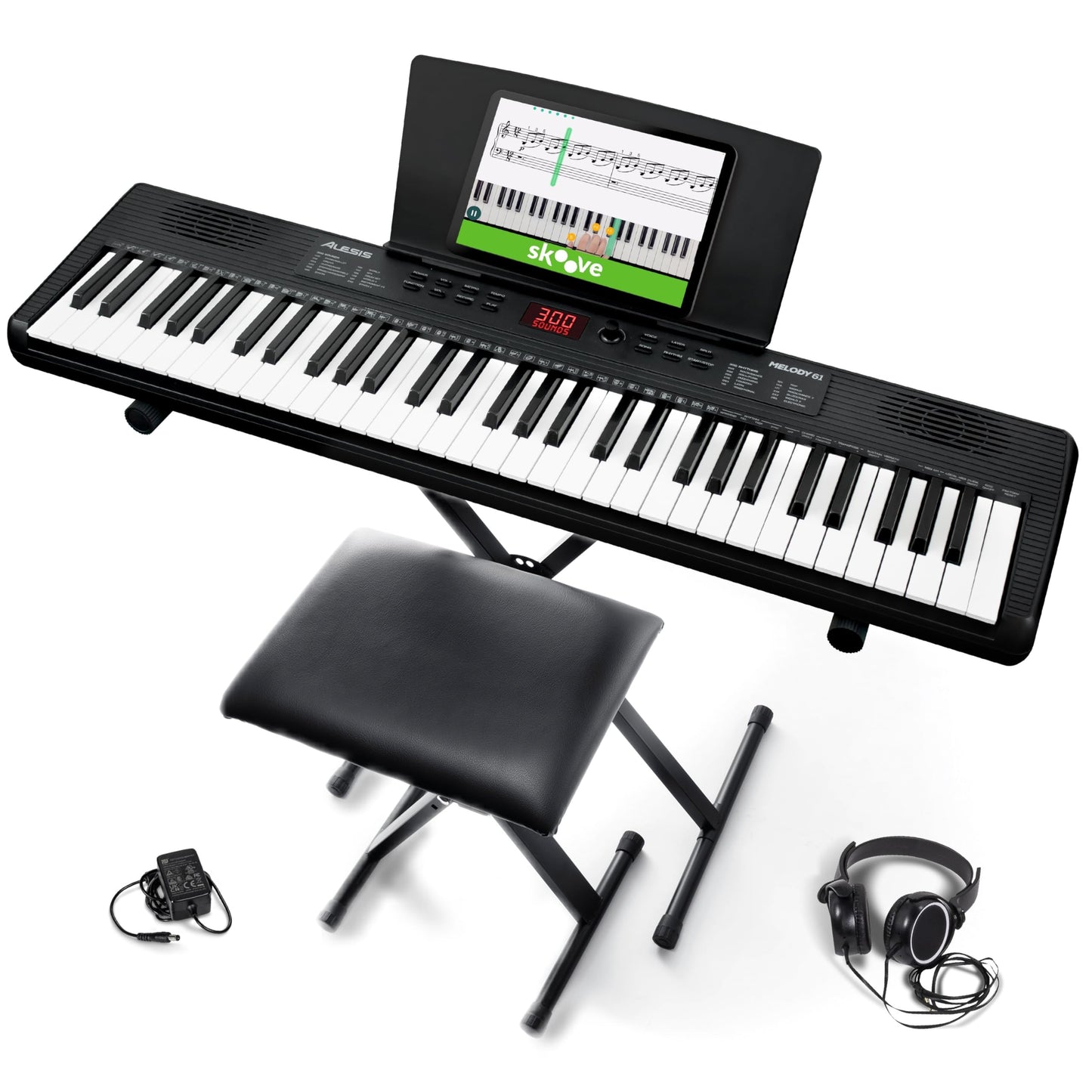 Alesis Melody 61 keyboard piano with 61 keys, built-in speakers, stand, bench, headphones, and tablet/music stand for beginners.
