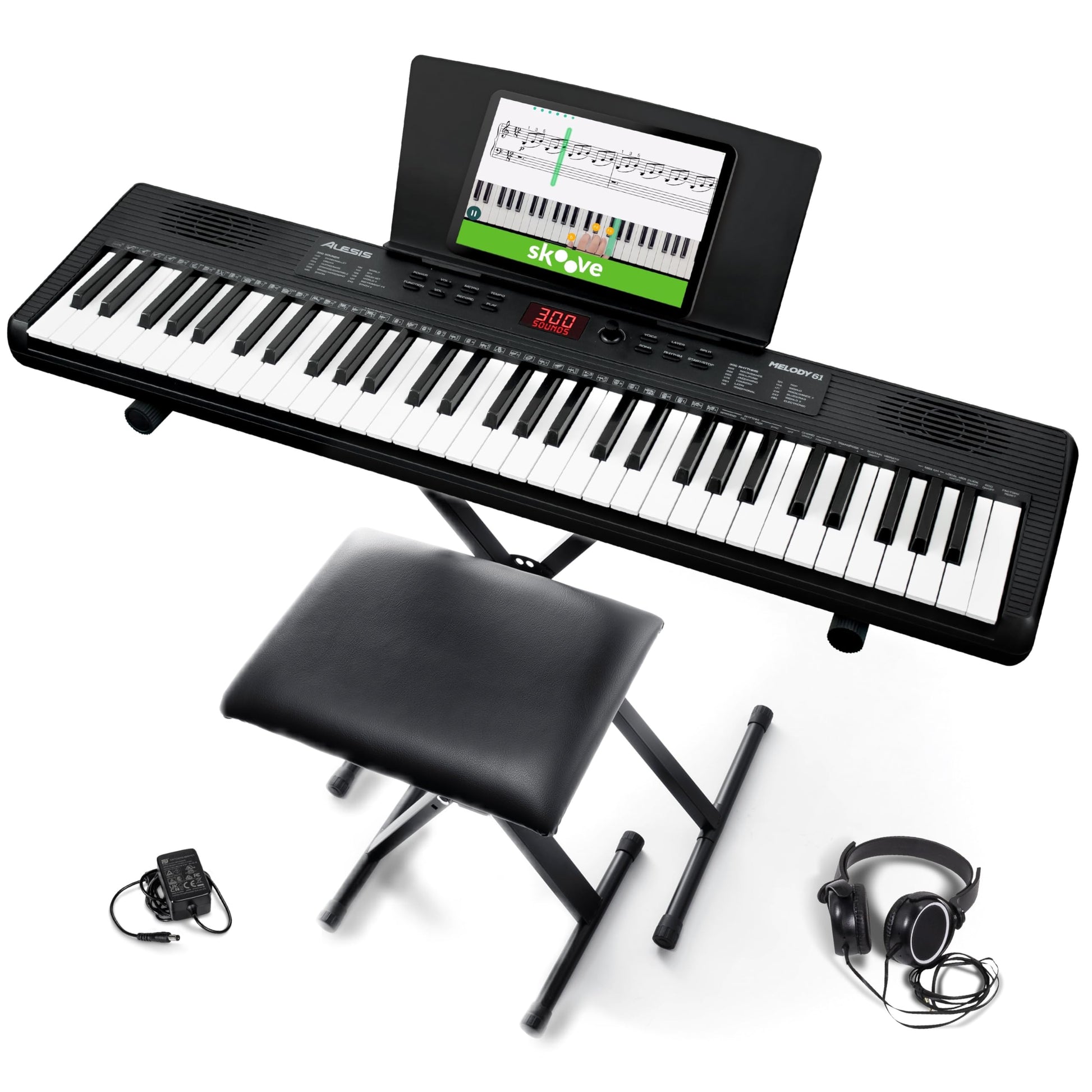 Alesis Melody 61 keyboard piano with 61 keys, built-in speakers, stand, bench, headphones, and tablet/music stand for beginners.