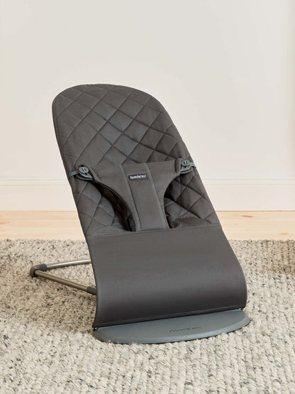 BabyBjörn Bouncer Bliss in woven fabric with classic quilt pattern, anthracite color, showing the ergonomic baby bouncer seat.