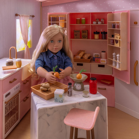 Our Generation cooking island playset with realistic features and accessories for 18-inch dolls, displayed in a bright kitchen.