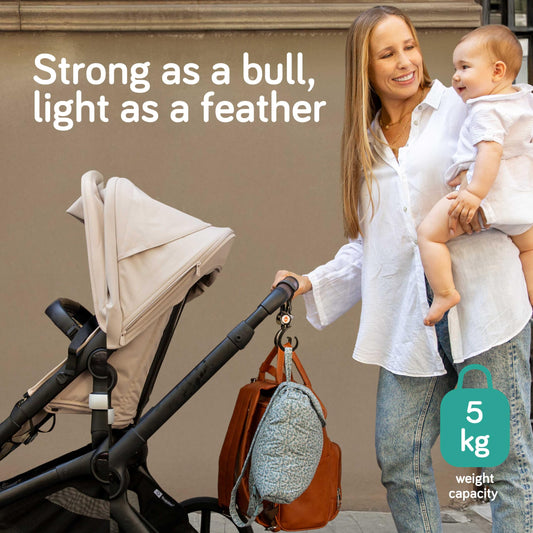 Baby Uma Buggy Clips 2-pack with swivel neck and strong straps, attached to pram bag for secure carrying of baby accessories.
