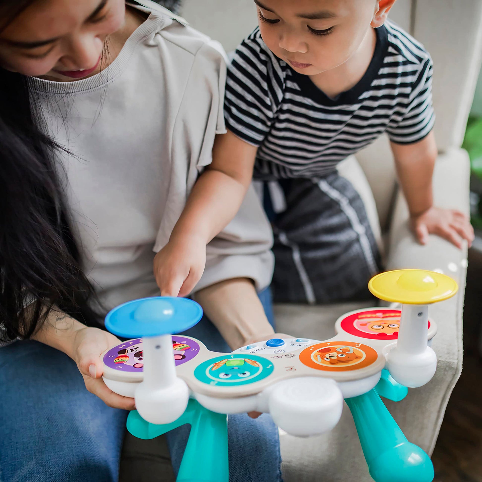 Baby Einstein Together in Tune Drums toddler toy featuring wooden drums with wireless magic touch controls for ages 12 months+