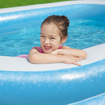 Bestway inflatable family paddling pool in outdoor garden setting, showcasing spacious design for family fun and relaxation.