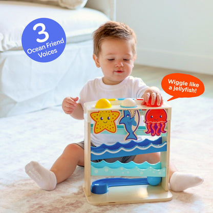 Wooden Ocean Friends interactive toy by Move2Play for toddlers, featuring colorful sea creatures and engaging designs.