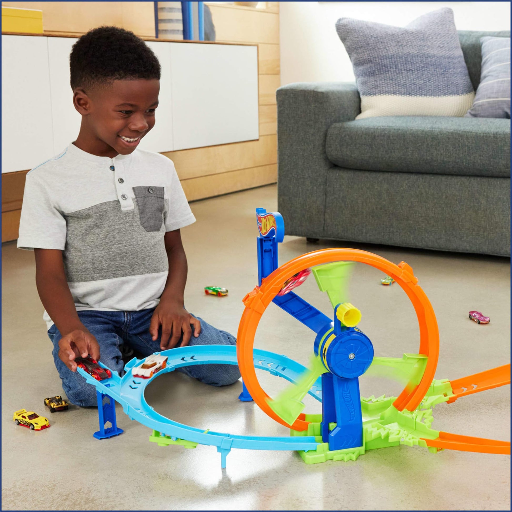 Hot Wheels toy car track set featuring a figure 8 track with a loop-kicker booster and die-cast vehicle.
