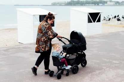Roma Uptown 4 Wheel Toddler Seat & Steering Wheel, Universal Buggy Board with Seat, Side Attachment for Pushchairs & Buggies, Supports Up to 25kg, Eliminates Double Pram Need