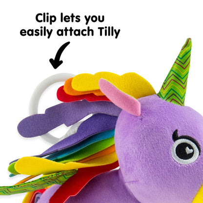 LAMAZE TOMY plush squeaky unicorn toy for babies, soft fabric with textured features for sensory play.