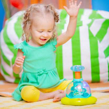 Bright Starts Press and Glow Spinner musical baby toy with colorful spinning and lights for infants 6 months and older.