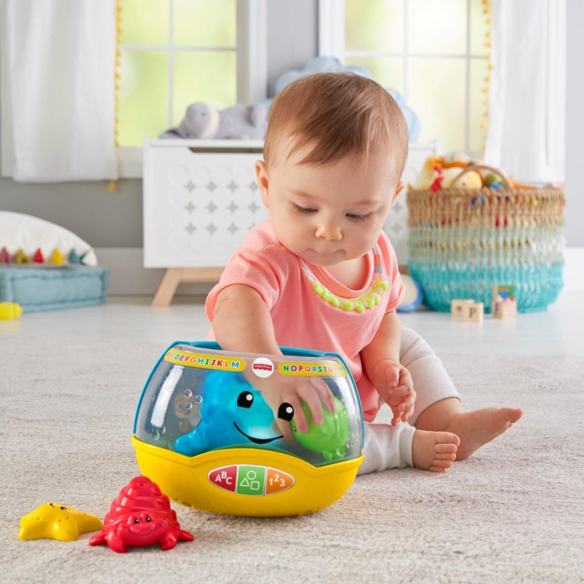Fisher-Price Laugh & Learn Magical Lights Fishbowl toy with colorful lights, fish figures, and smart stages learning content for infants.