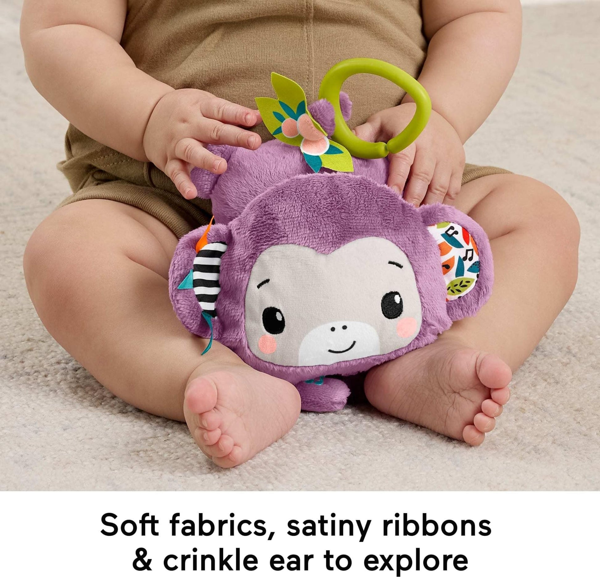 Fisher-Price Baby Stroller Toy Purple Monkey musical plush with crinkle and clackers for newborns, designed for sensory development.