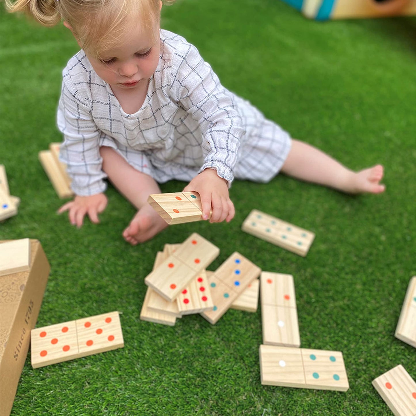 Set of wooden giant dominoes for kids by Jaques of London, outdoor garden game with large numbered tiles for children.