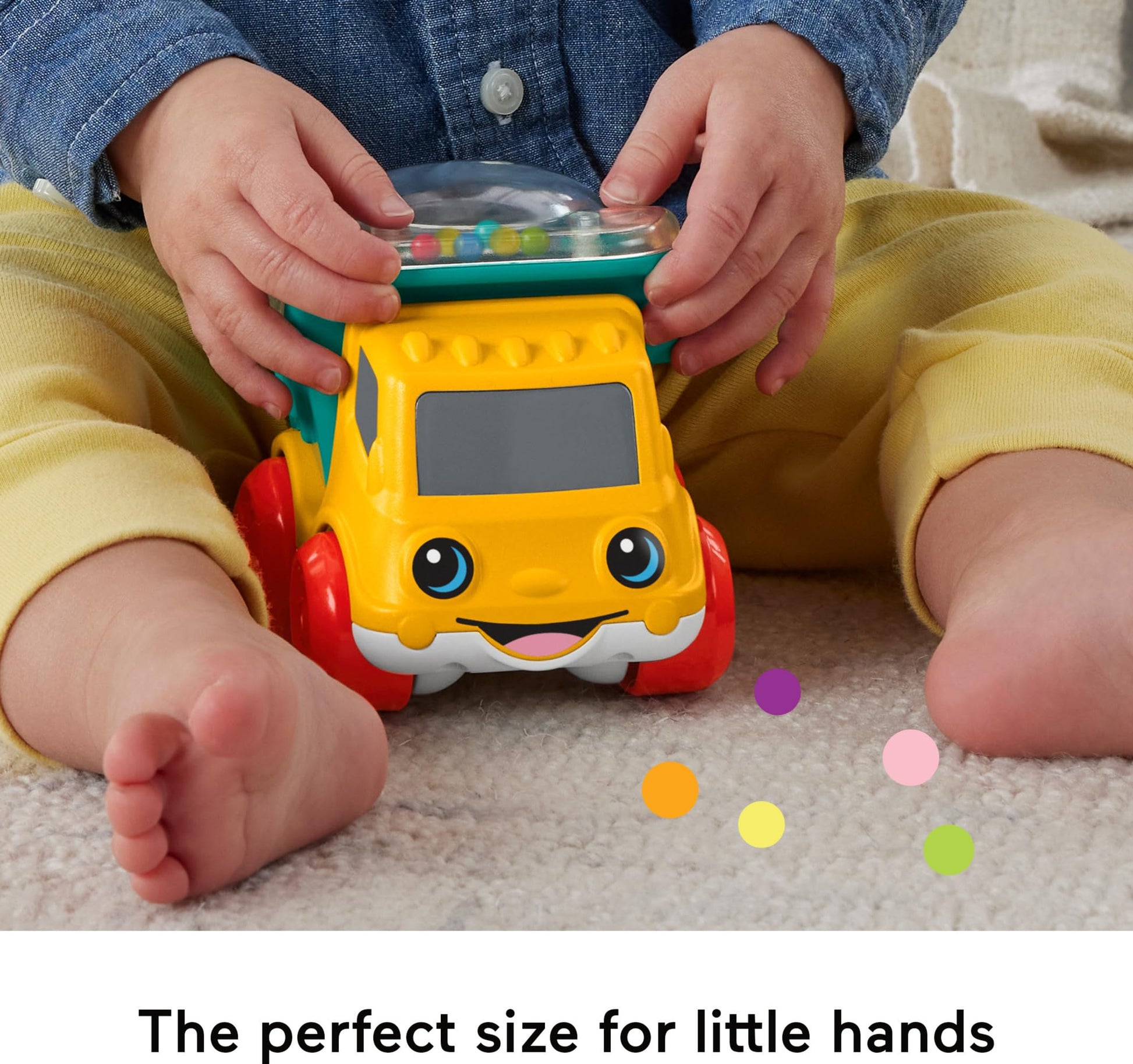 Fisher-Price Poppity Pop Dump Truck toy with colorful design, featuring pop-up balls and a sturdy yellow and red truck body.