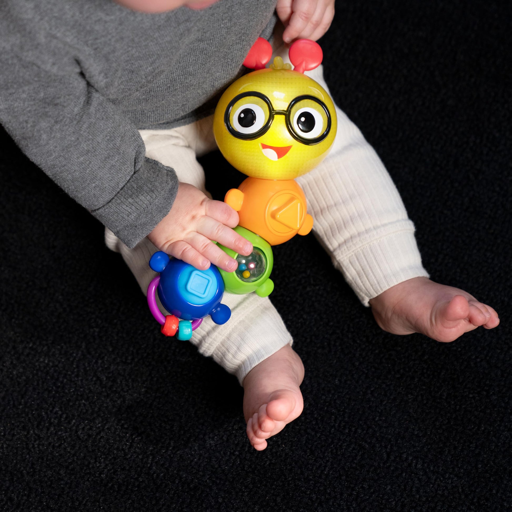 Baby Einstein Twist-a-Pal Cal sensory toy with colorful beads, music, and textured features for infants aged 6 months and up.