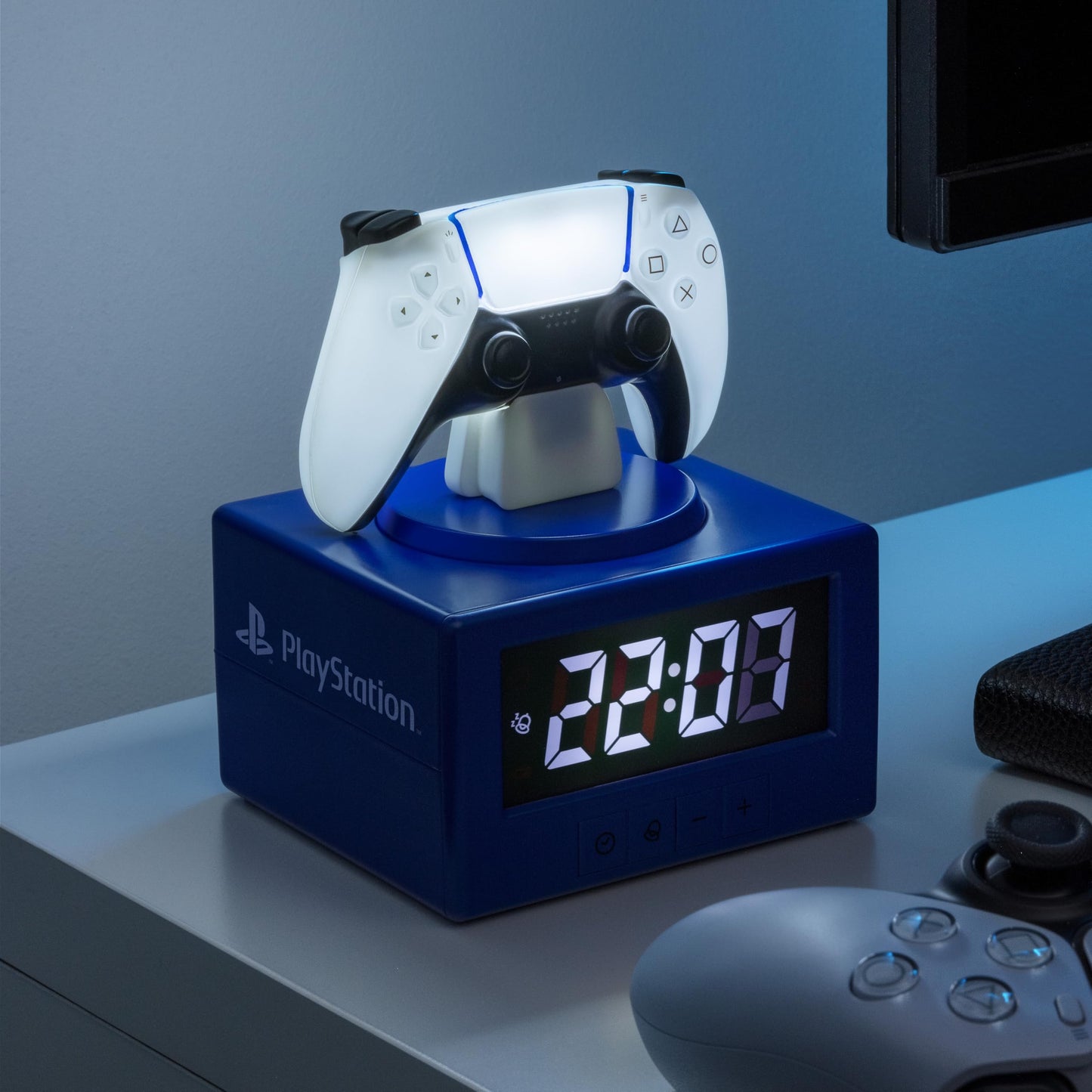 Paladone PlayStation DualSense controller digital alarm clock with night light, suitable for gaming rooms and bedrooms.