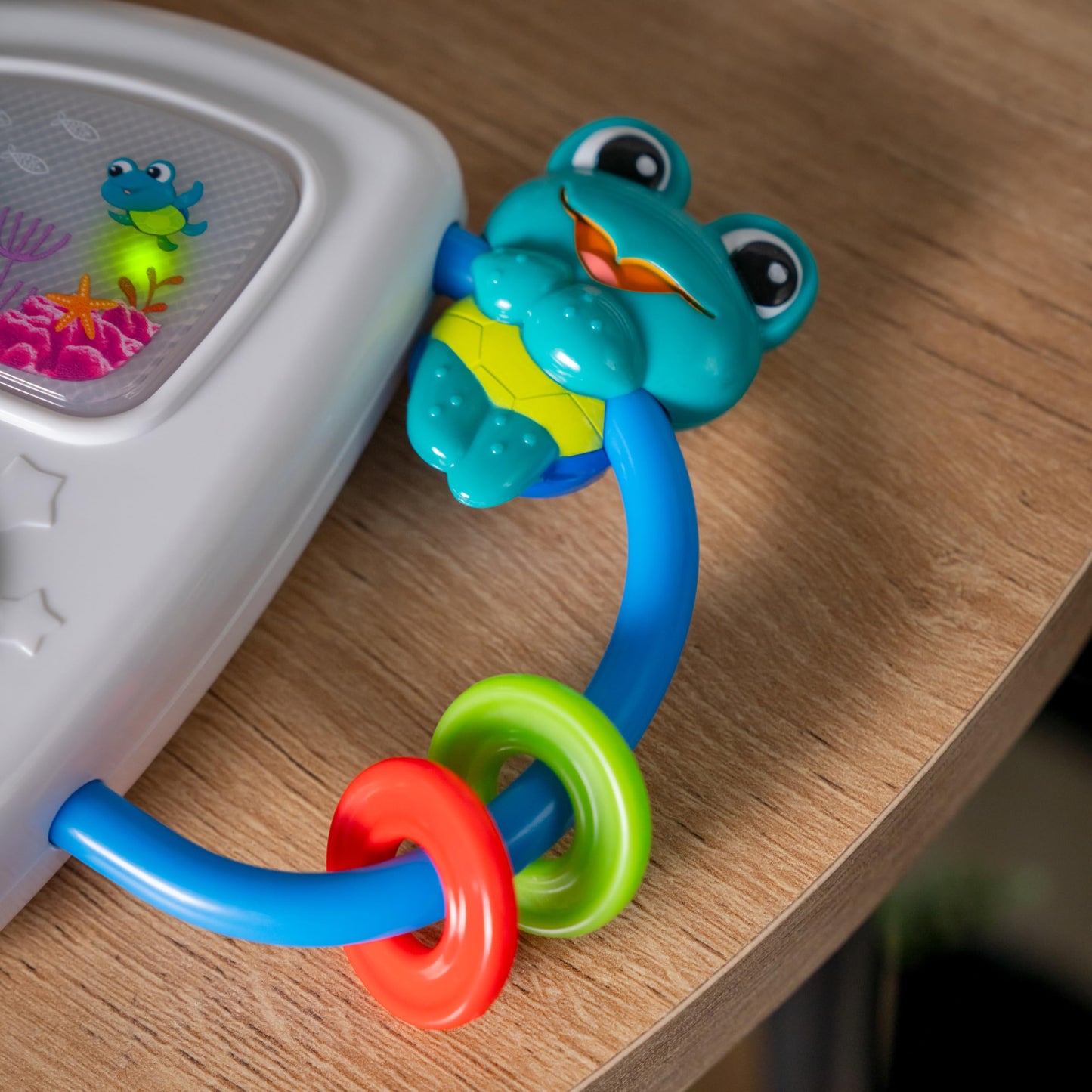 Baby Einstein Ocean Explorers musical light-up toy for babies 3+ months, featuring colorful ocean-themed design and interactive elements.