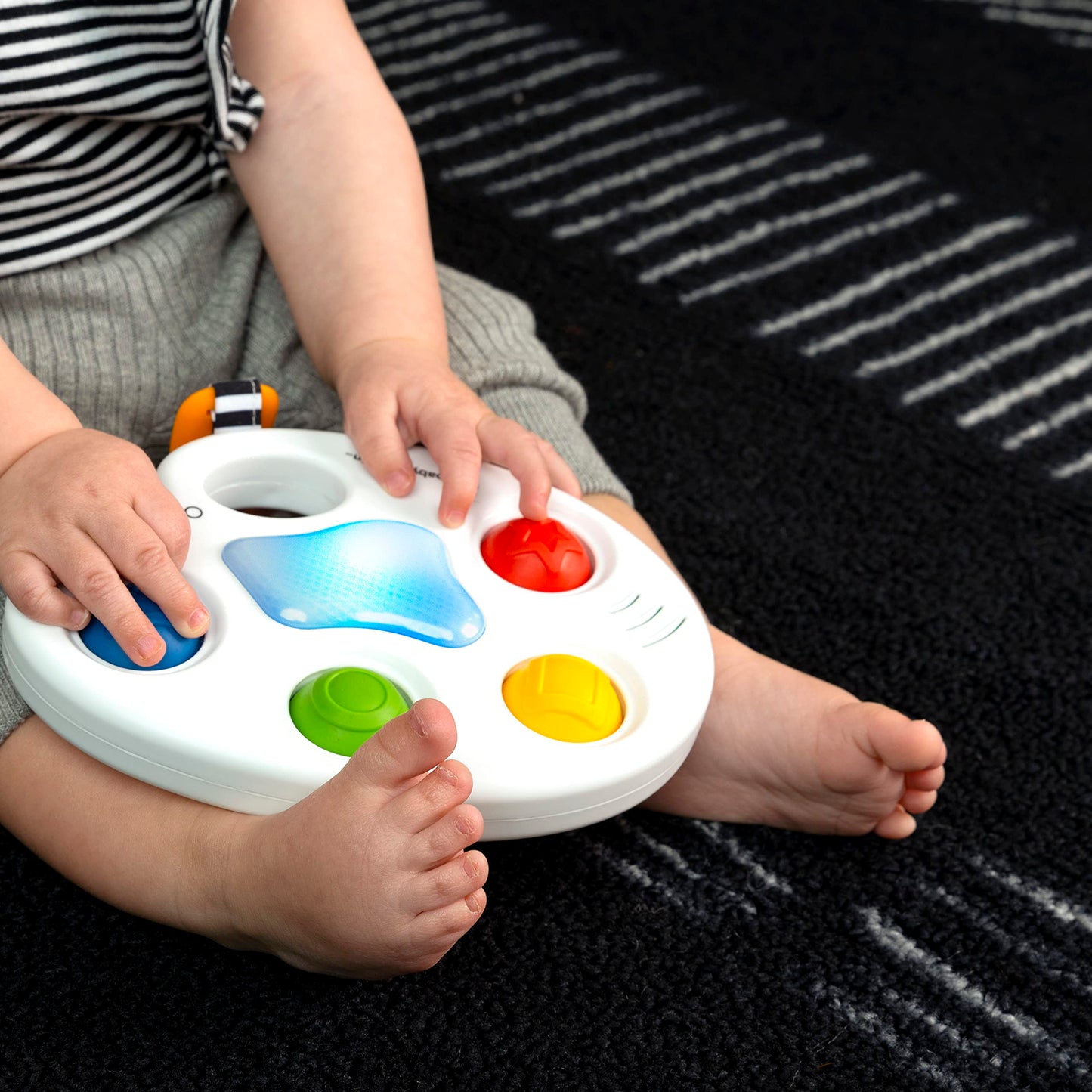 Baby Einstein Color Palette Popper sensory fidget toy for infants ages 6 months and up, featuring colorful poppers and soft textures.