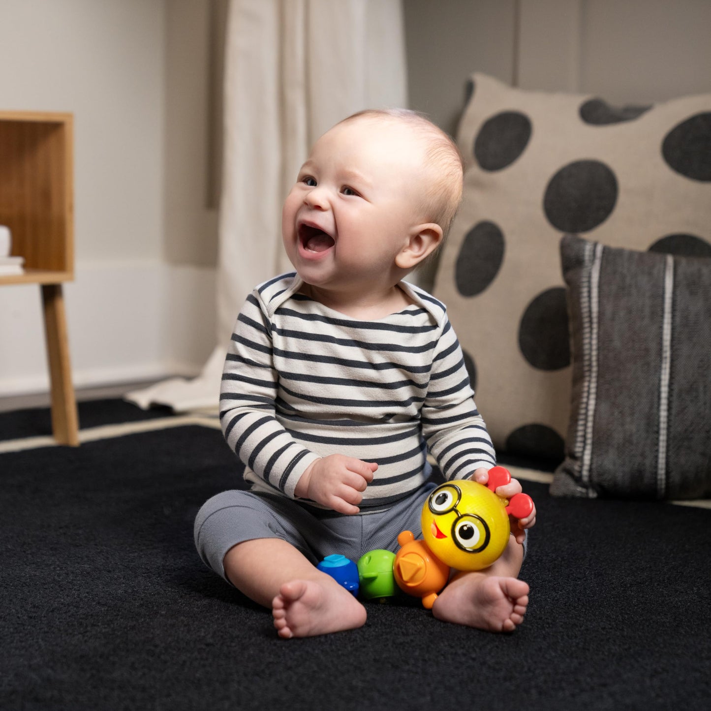 Baby Einstein Twist-a-Pal Cal sensory toy with beads and music, designed for babies 6 months and up.