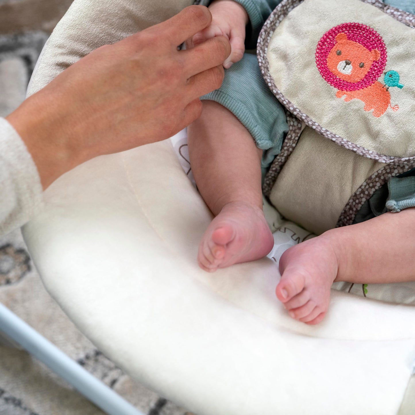 Ingenuity Soothe 'n Delight 6-speed baby swing with music and toy bar, compact portable design, shown folded for travel.