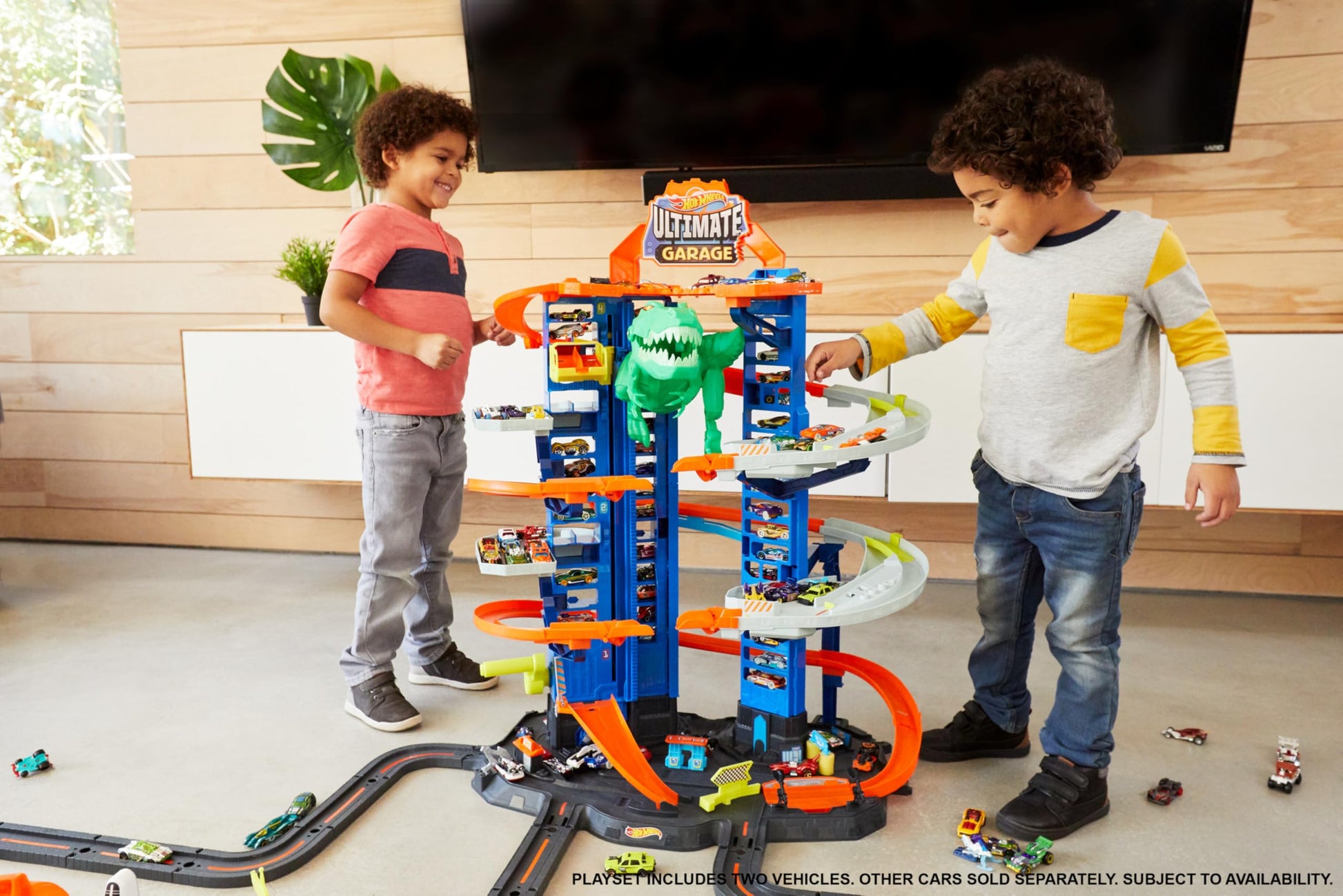 Hot Wheels City Ultimate Garage Playset with T-Rex, multi-level racetrack, and space for 100 toy cars.