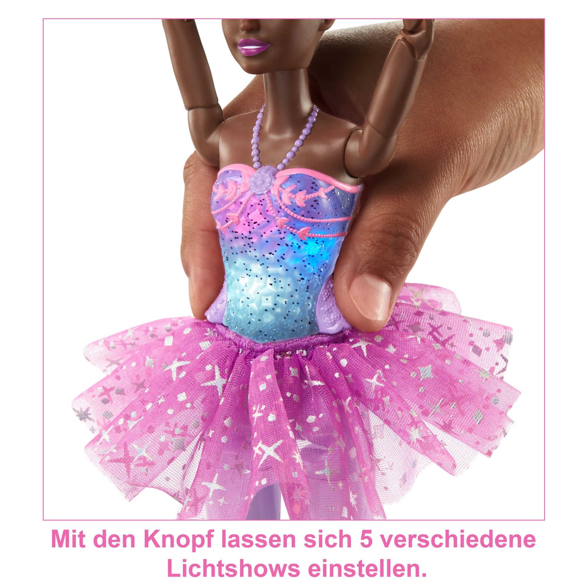 Barbie Dreamtopia ballerina doll with brunette hair, light-up feature, purple tutu, and removable headband.