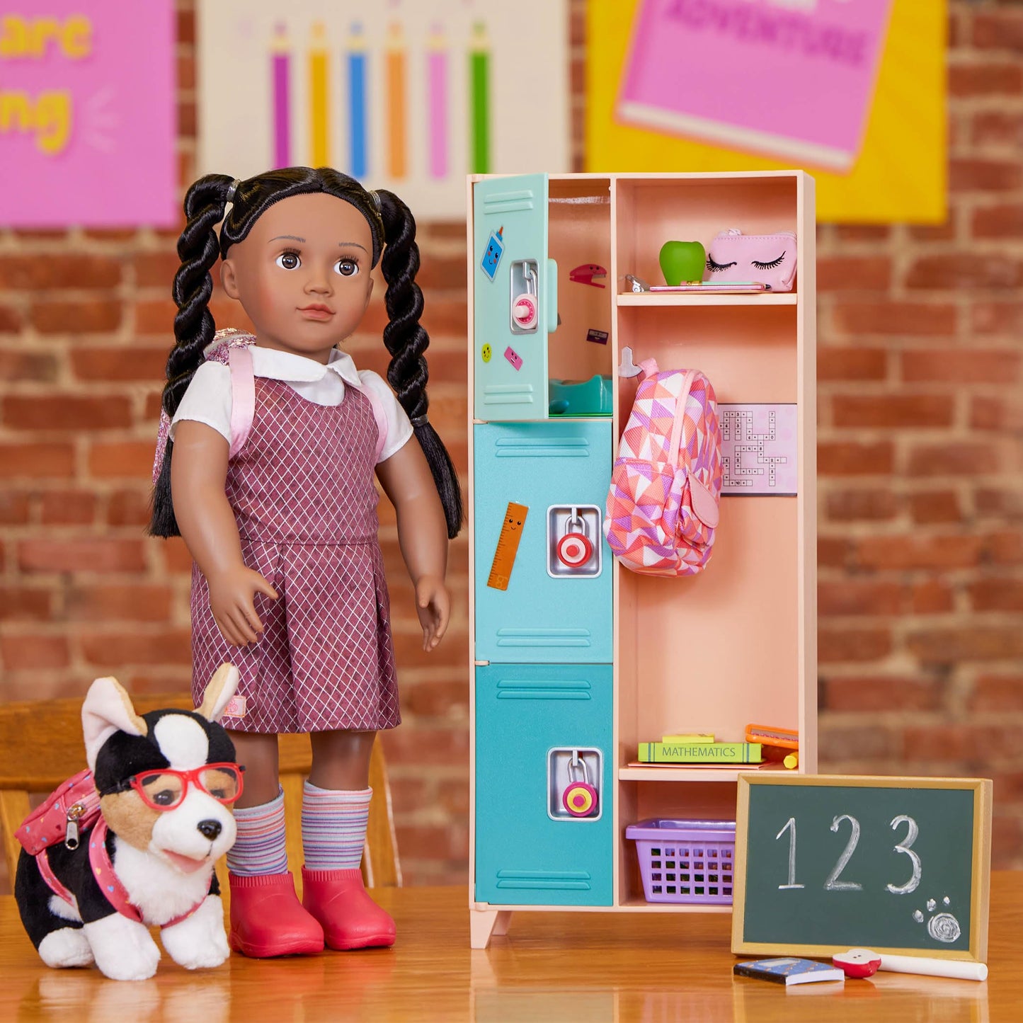 Our Generation Off To School doll accessories set with backpack, books, notebook, and school supplies for children aged 3+