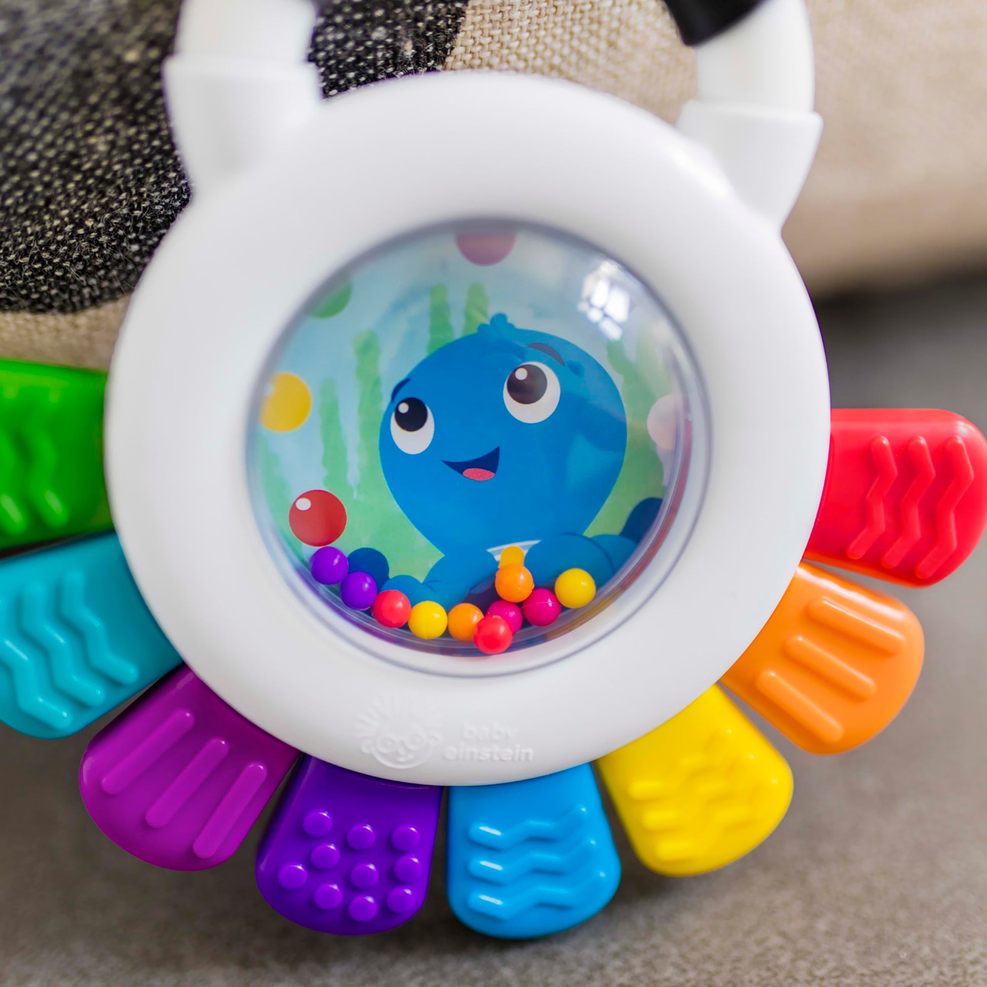 Baby Einstein Outstanding Opus The Octopus sensory rattle and teether toy with colorful design for infants 3 months and up.