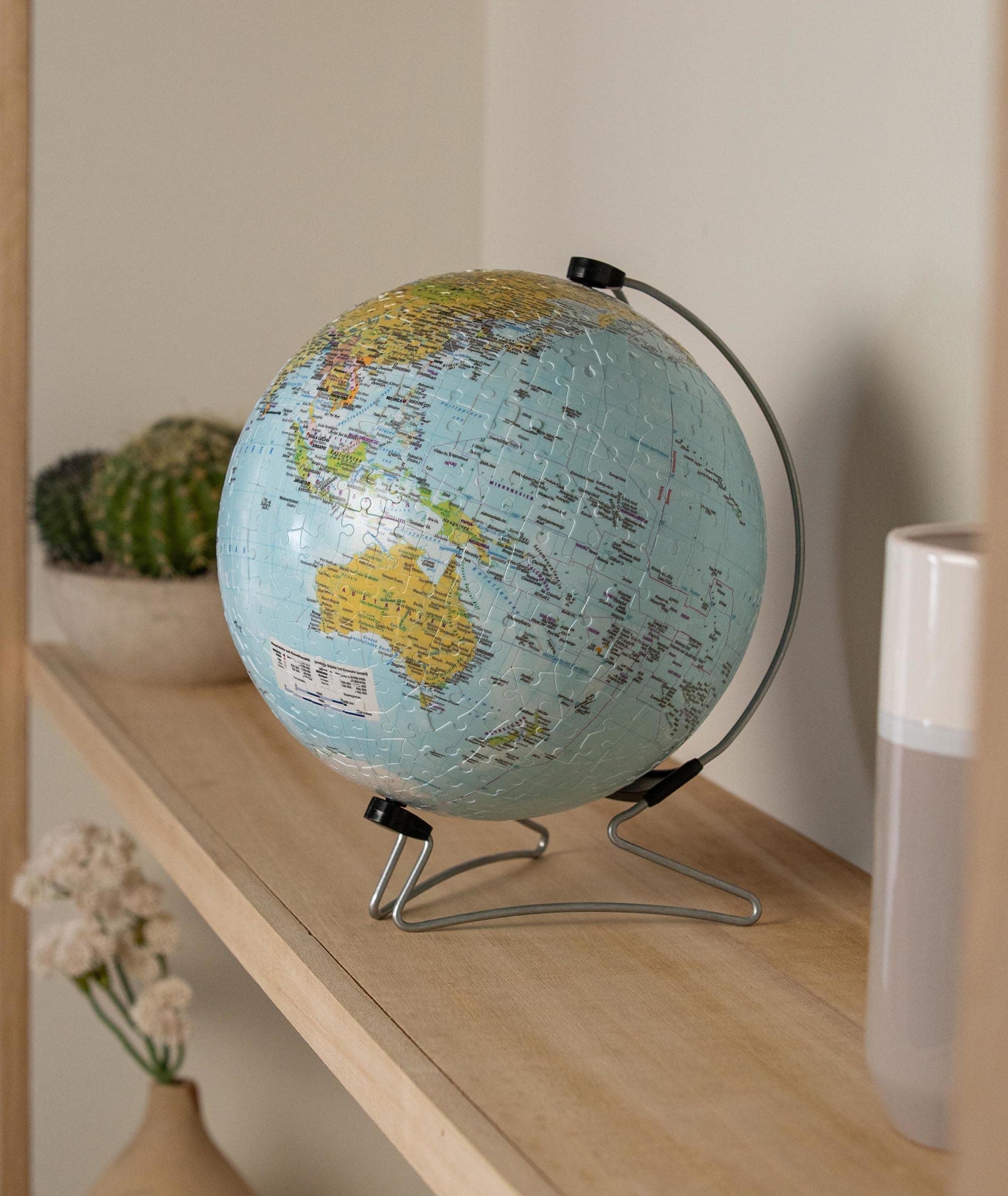 Ravensburger 3D world globe puzzle on stand with 540 plastic pieces, suitable for ages 10 and up, no glue needed.