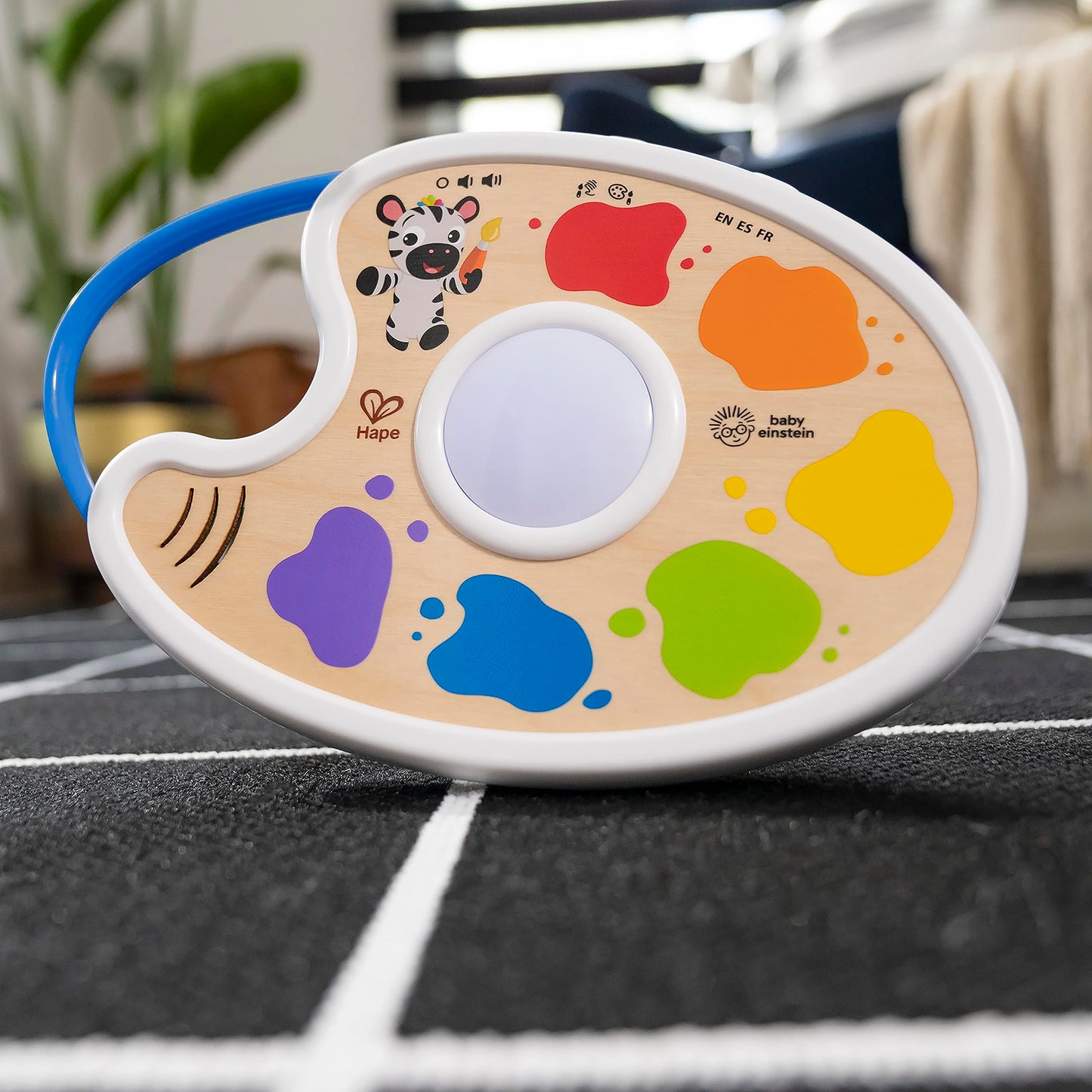 Baby Einstein Playful Painter Magic Touch Color Palette light-up toy for babies 6+ months, featuring multicolor design and interactive paint palette.