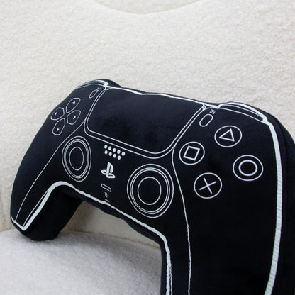 Black PlayStation official licensed controller-shaped cushion pillow, glow-in-the-dark plush decor for bedroom or gaming setup.