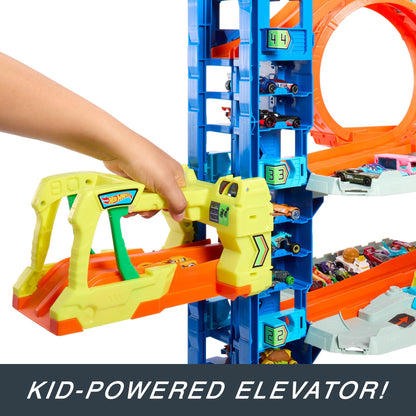 Hot Wheels City Ultimate Garage playset with 4 levels, 2 die-cast cars, and storage for 50+ 1:64 scale cars.