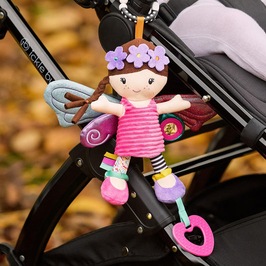 Colorful Nuby Things with Wings fairy pram toy with baby-safe mirror, teething features, and universal clip for baby strollers.