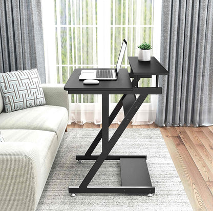Dripex black computer desk with monitor shelf, mobile wheels, storage shelves, Z-shaped design, ideal for small home office spaces